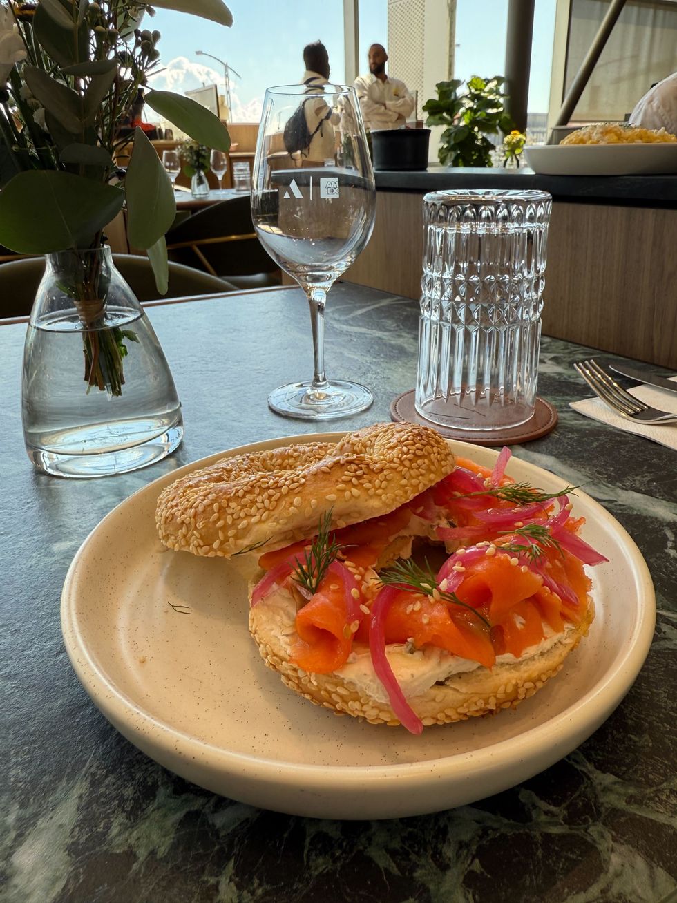 A bagel on a lounge table. 