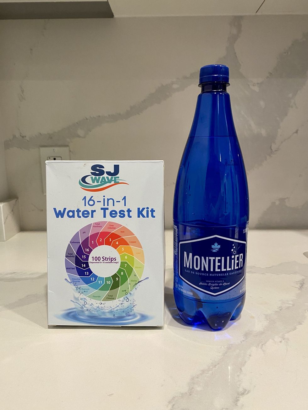 A bottle of Montellier sparkling water and a 16-in-1 water test kit.\u200b