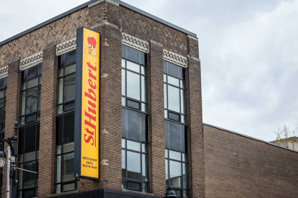 A brick building with a St-Hubert sign