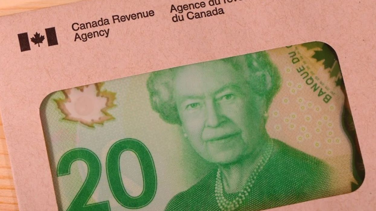 A Canadian $20 bill inside a Government of Canada envelope.