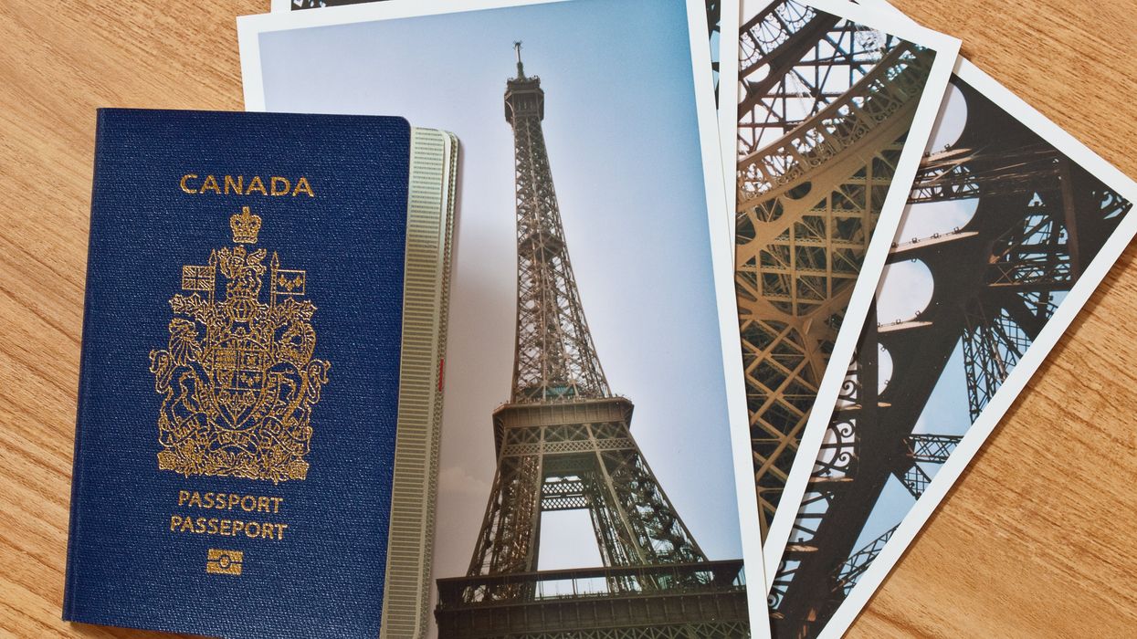 A Canadian passport on a table, alongside a selection of images of vacation destinations.