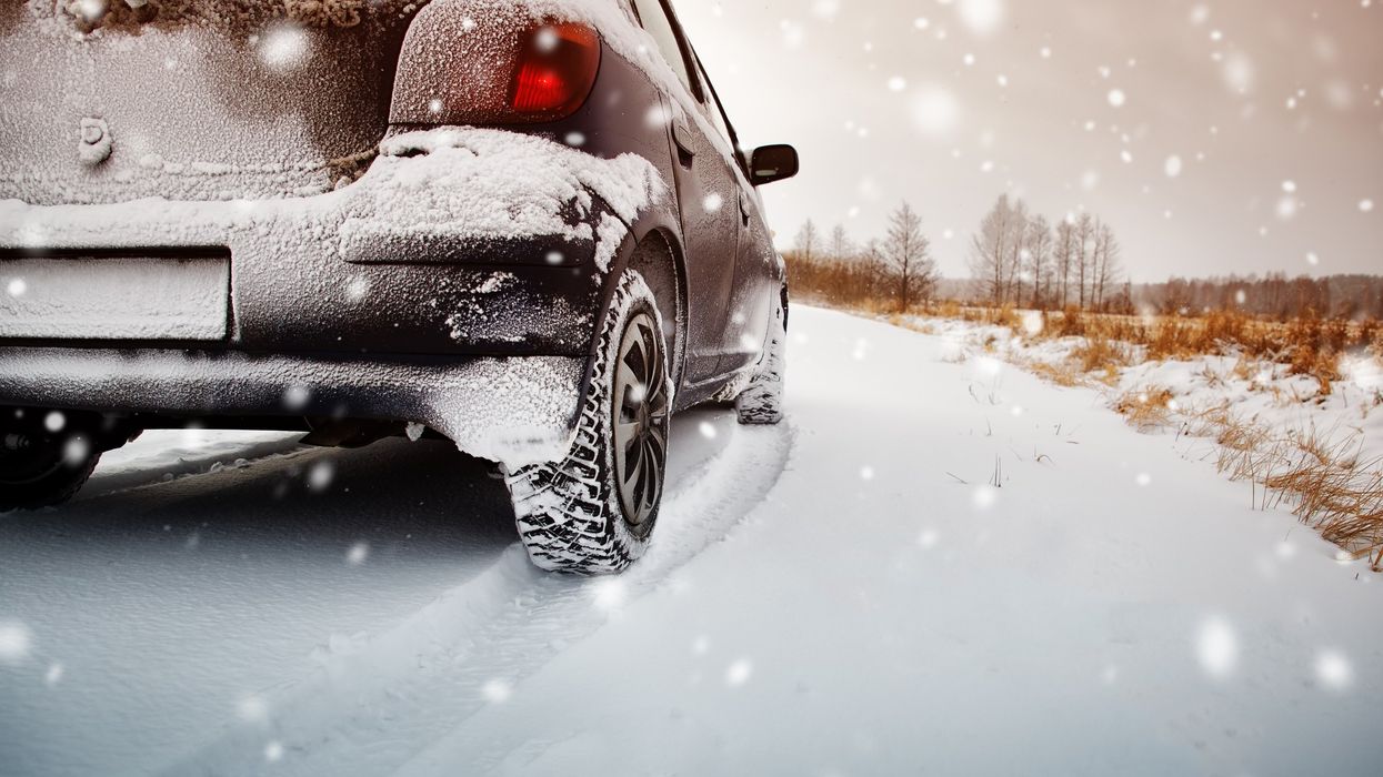 A car driving in snow with winter tires on (illustrative).