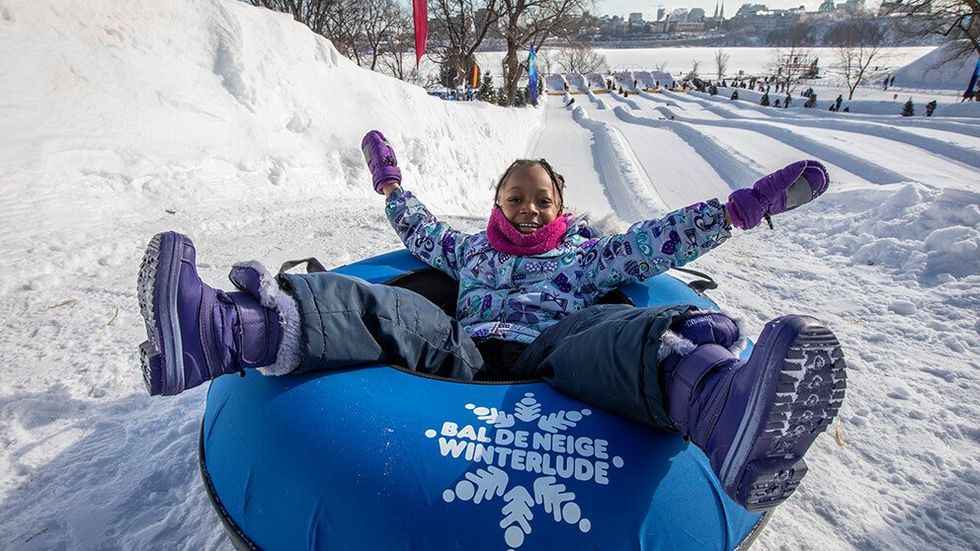 A child on a Winterlude-themed inner tube.