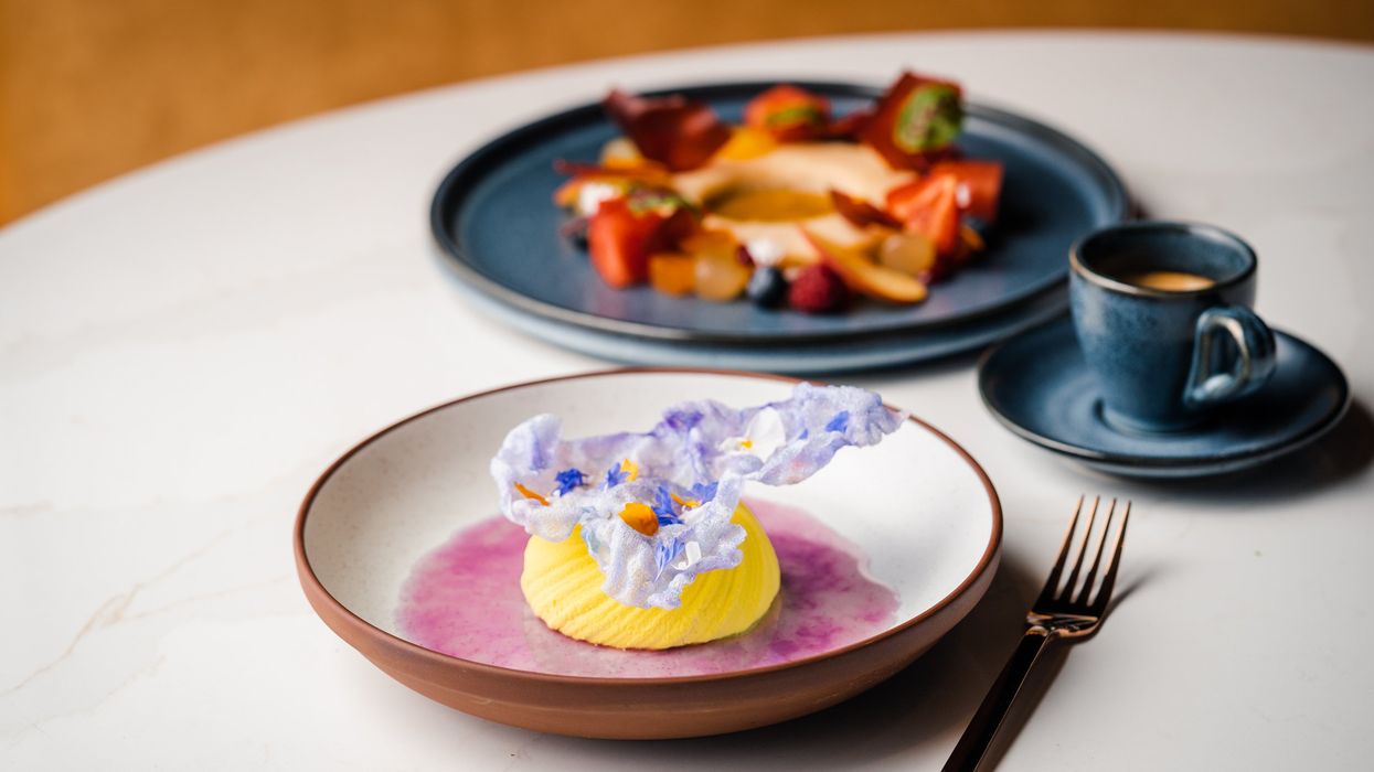 A colourful dessert with coffee.