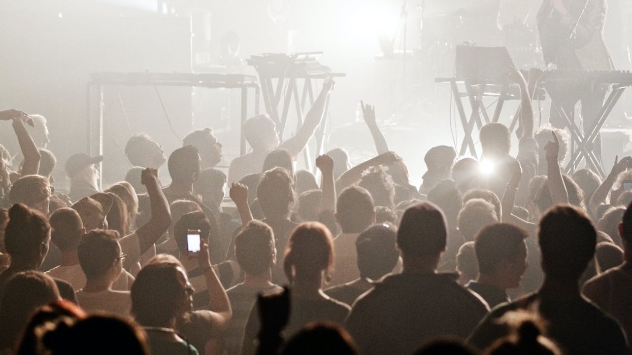 A crowd gathers in front of a stage during a concert in Montreal.
