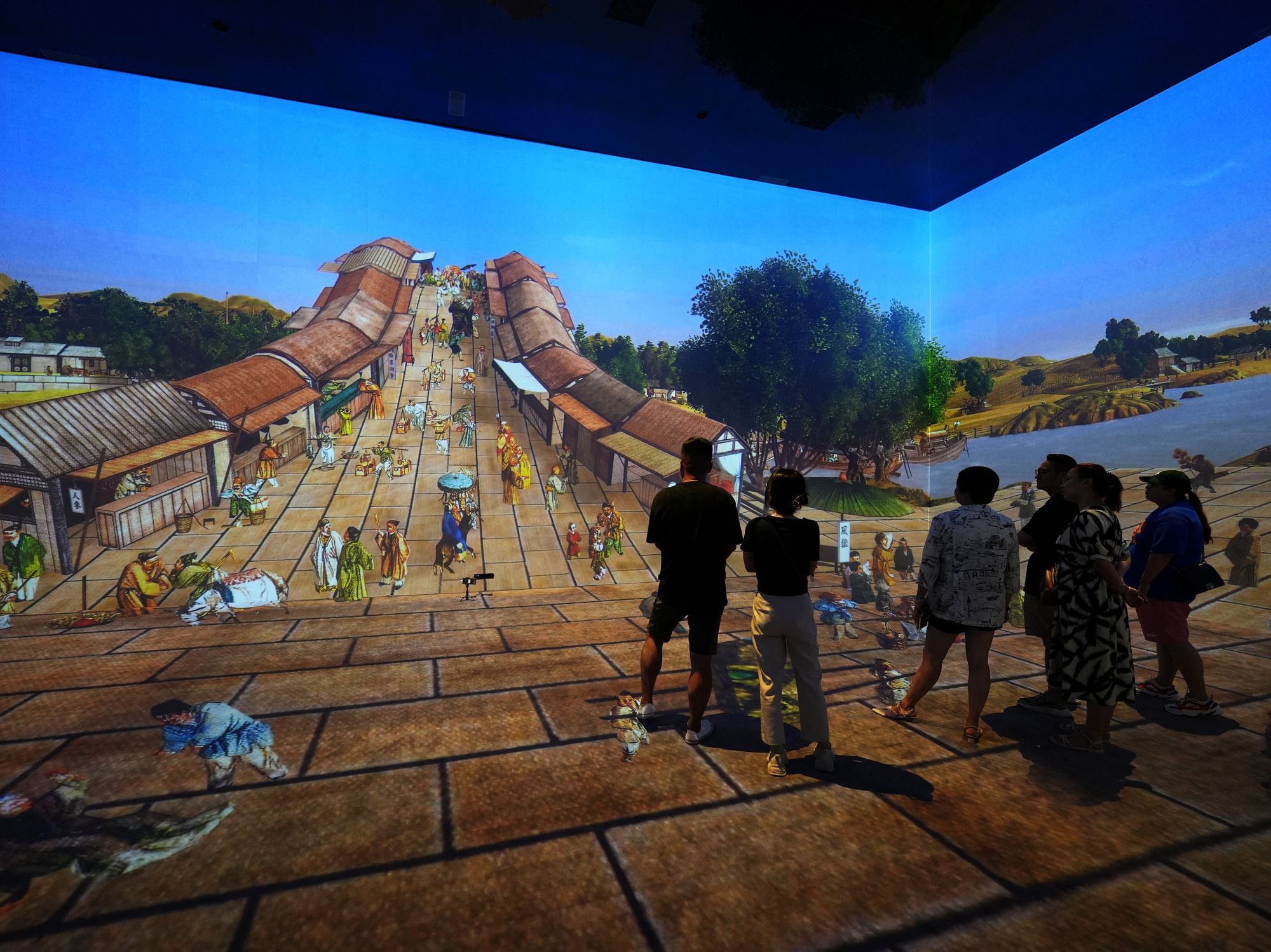 A digital rendition of famous Chinese handscroll painting, "Along the River During the Qingming Festival."