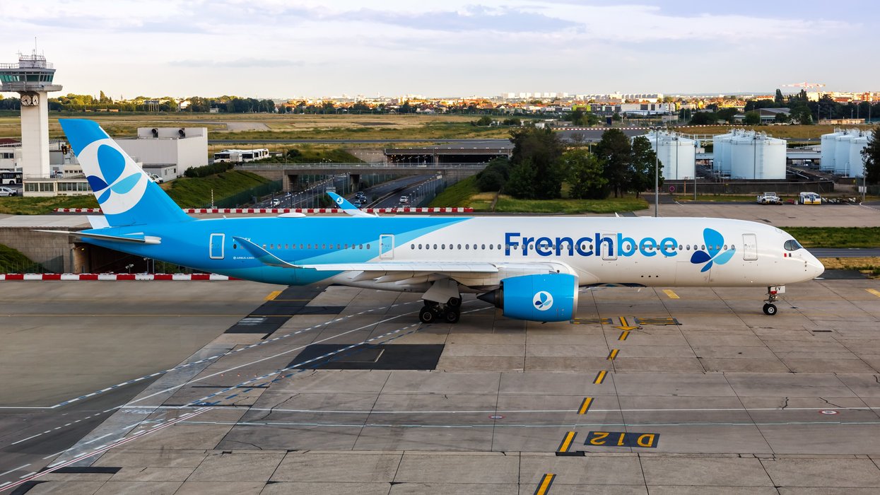 A French bee airplane on a runway.