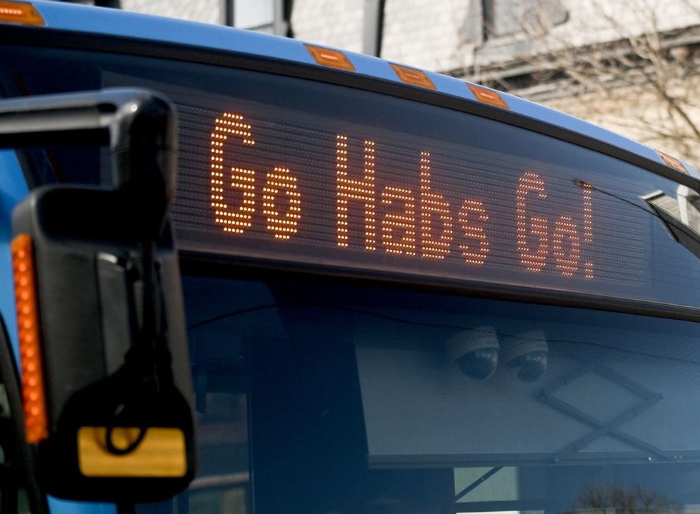 A 'Go Habs Go' slogan is shown on a Montreal city bus in Montreal on Thursday, April 23, 2026. 