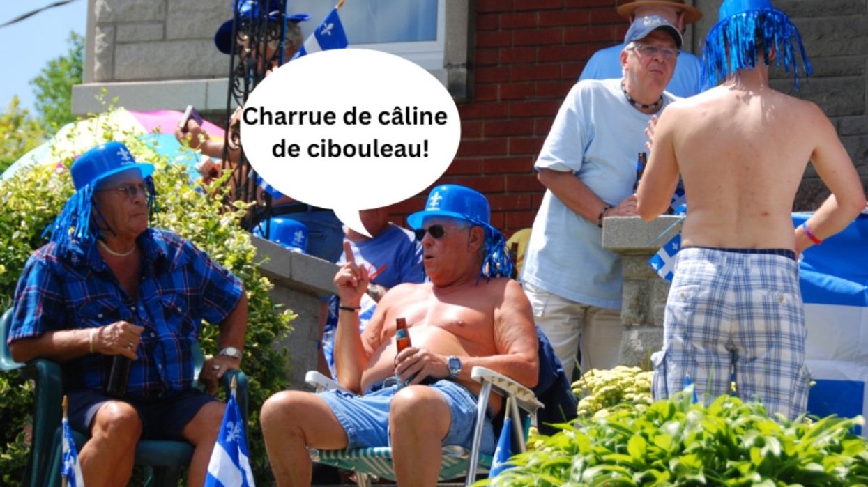 A group of people sitting outside during Saint-Jean Baptiste in Quebec.
