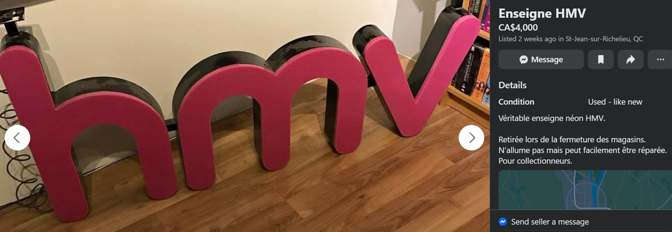 A HMV sign for sale.