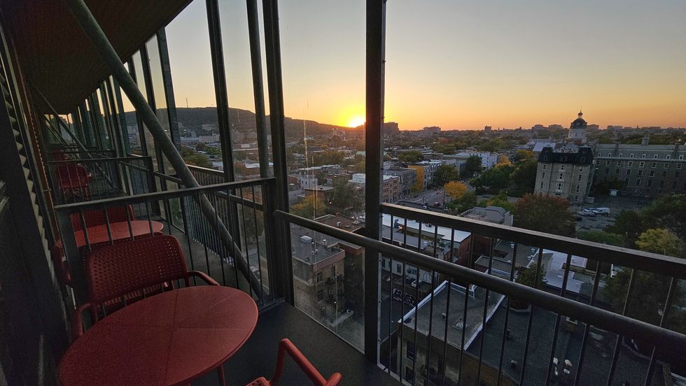 A hotel balcony overlooking the Plateau and Mount Royal.