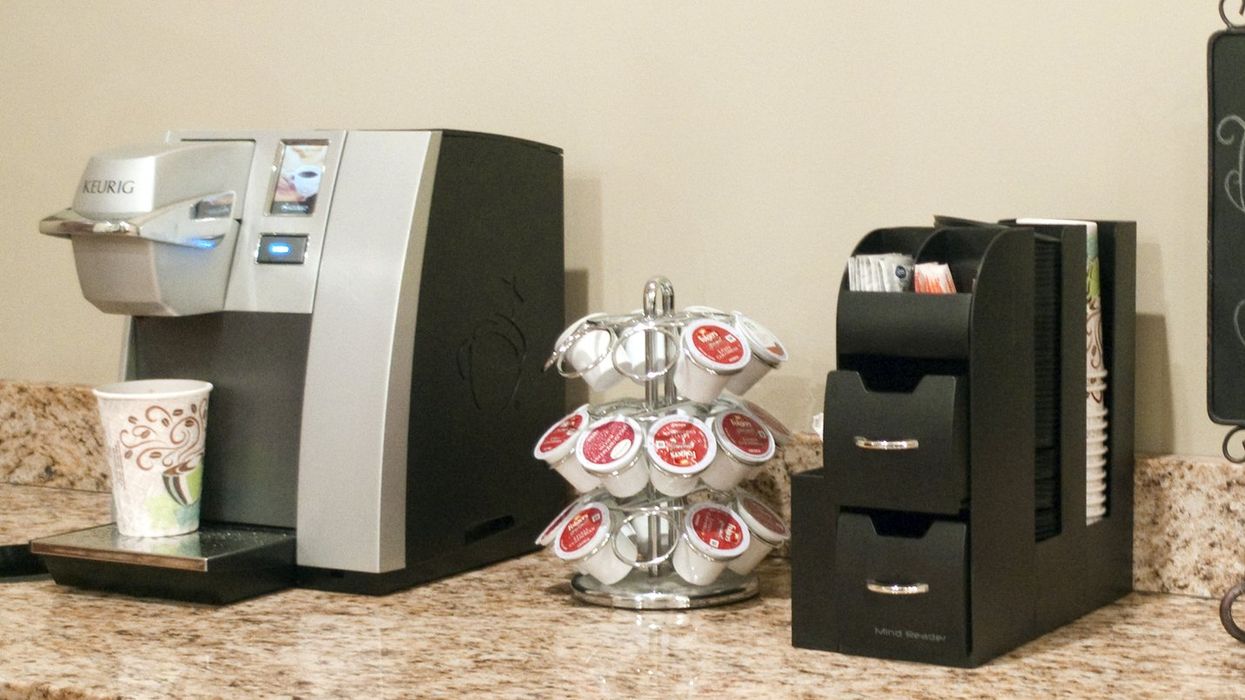 A Keurig coffee machine on counter.