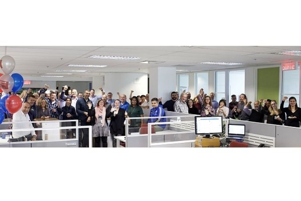 A large group of people in an office.