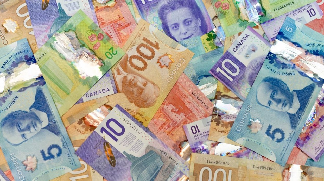 A layout of Canadian money ($5, $10, $20, $50 and $100 Canadian bills).