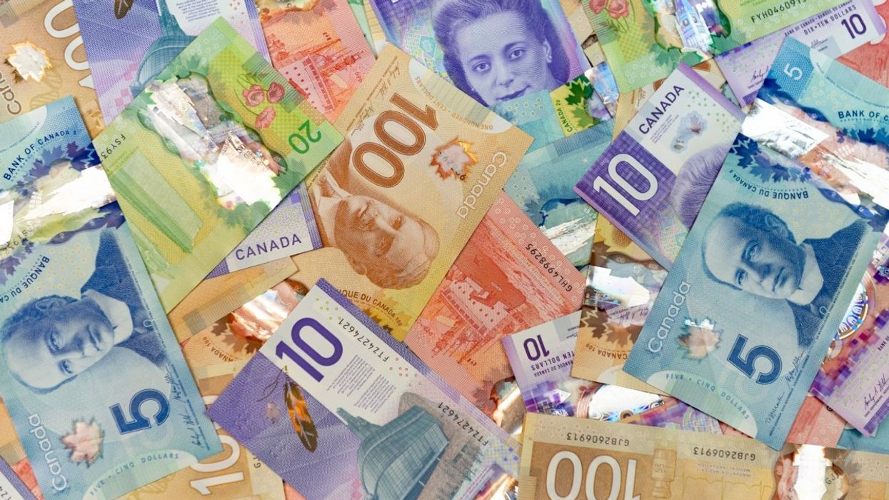 A layout of Canadian money ($5, $10, $20, $50 and $100 Canadian bills).