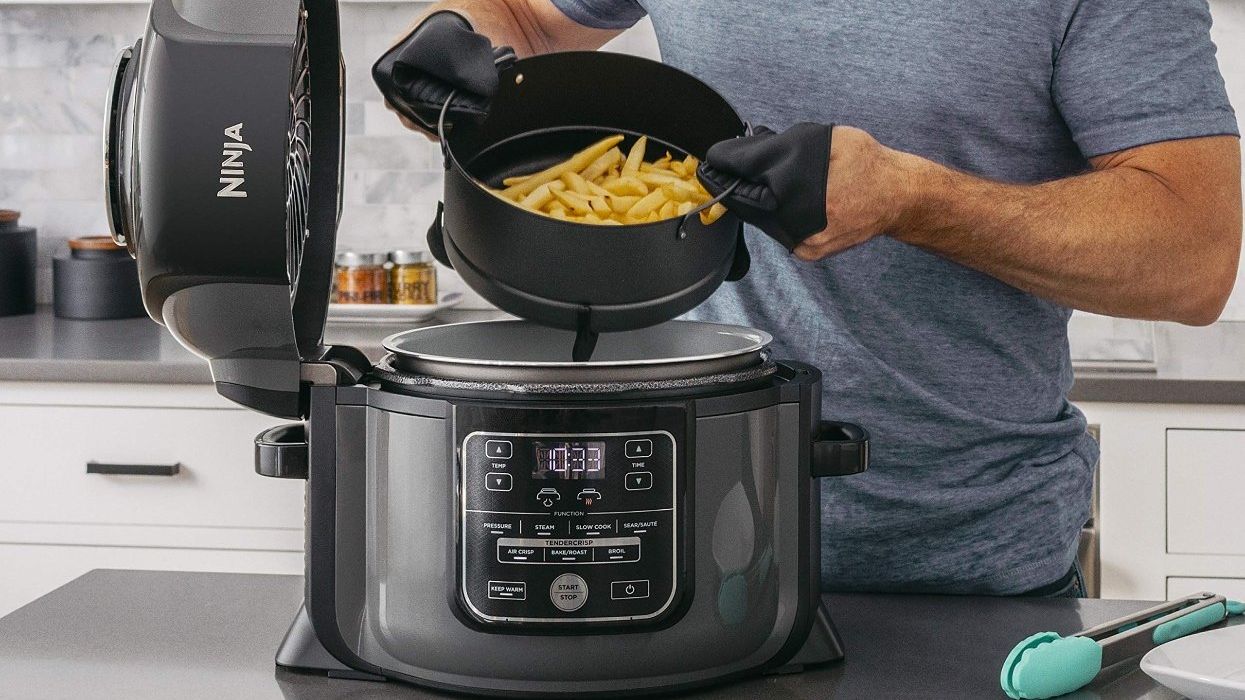A man using a Ninja pressure cooker.