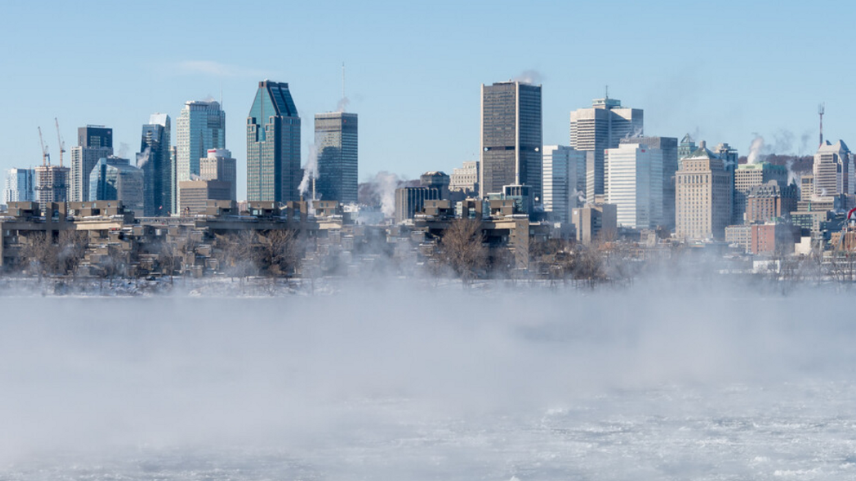 A mist rises over the St Lawrence River in winter.