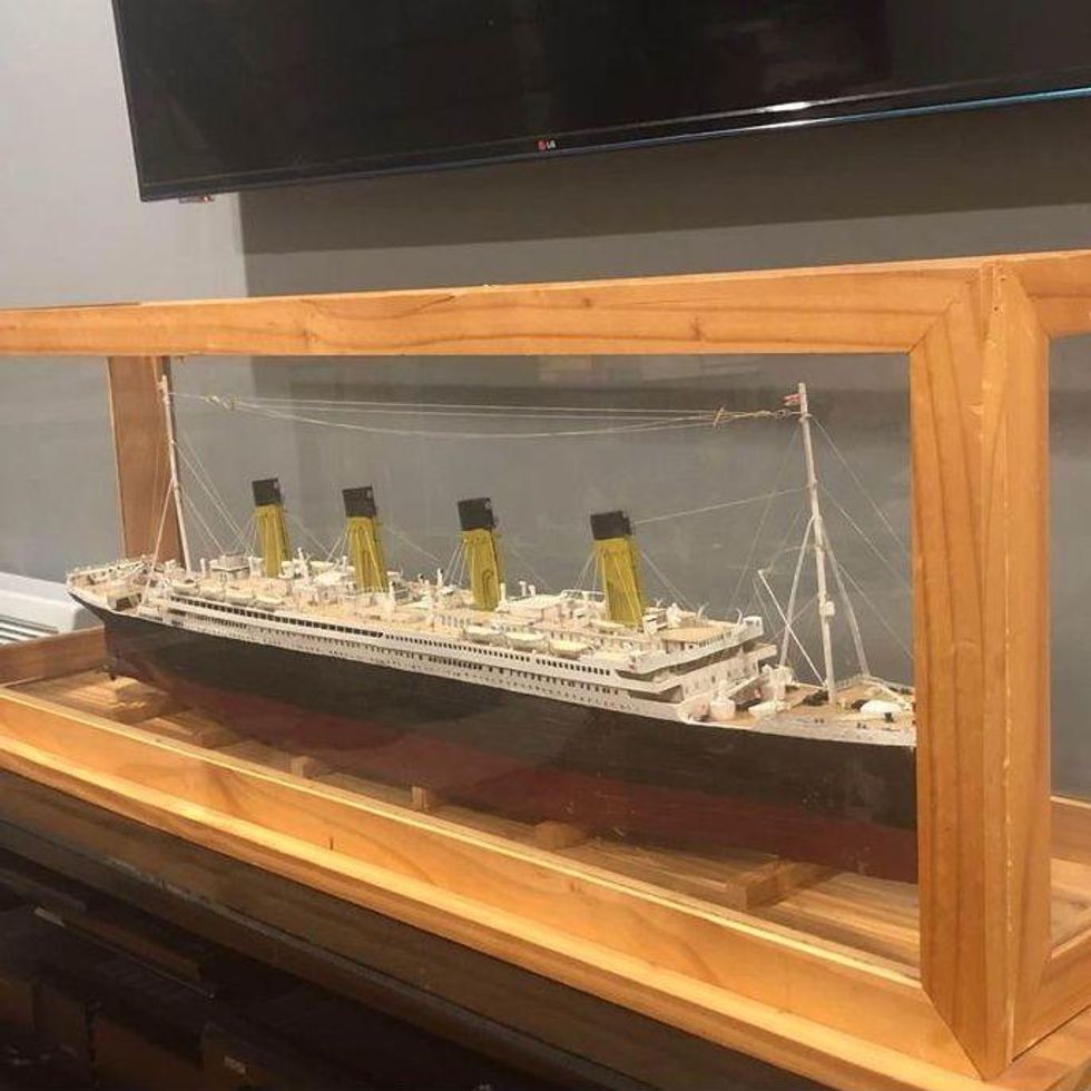 A model of the Titanic in a case.