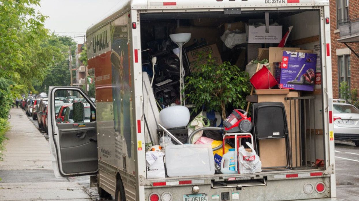 A moving truck filled with household goods on moving day in Montreal.