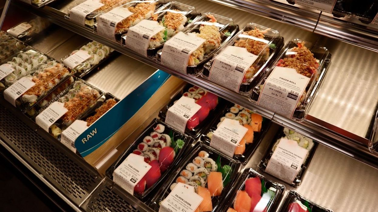 A number of pre-packaged sushi rolls at a grocery store in Canada.