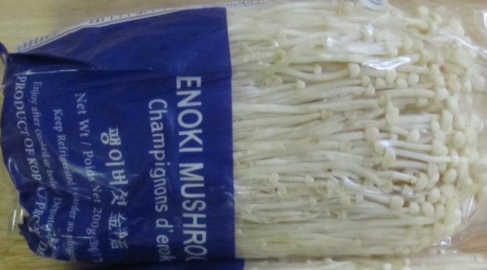 A package of Enoki mushrooms.