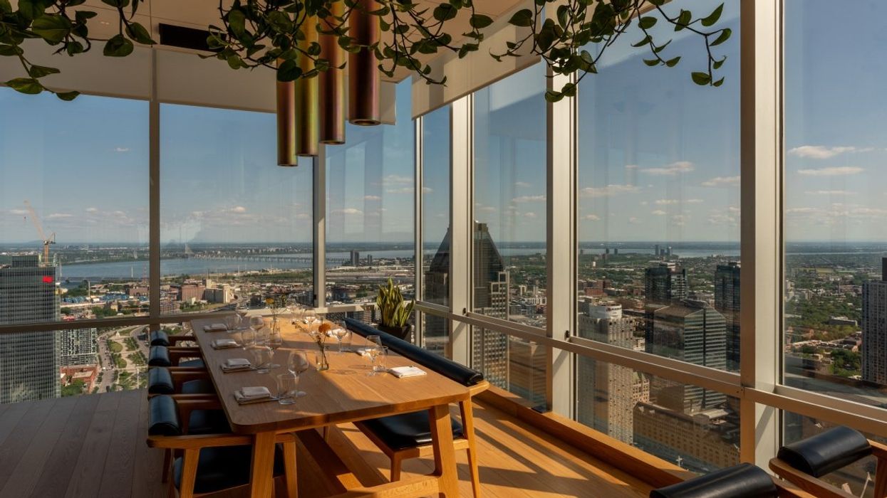 A panoramic view of the city of Montreal through the windows of the restaurant Hiatus located at Place Ville Marie.
