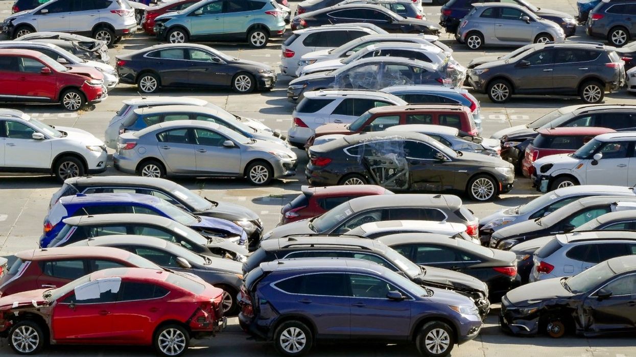 A parking lot full of damaged and recalled vehicles..