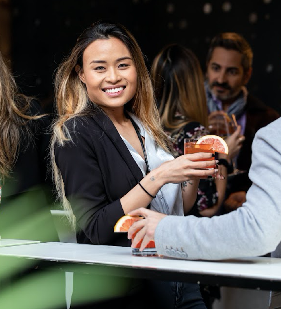 A person holding a drink.