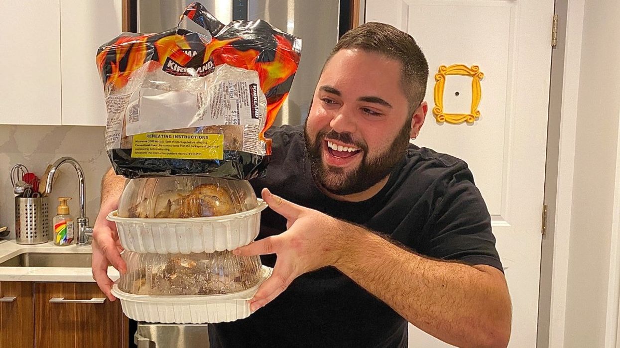 A person holding three rotisserie chickens from Costco, IGA and Maxi grocery stores in Quebec.