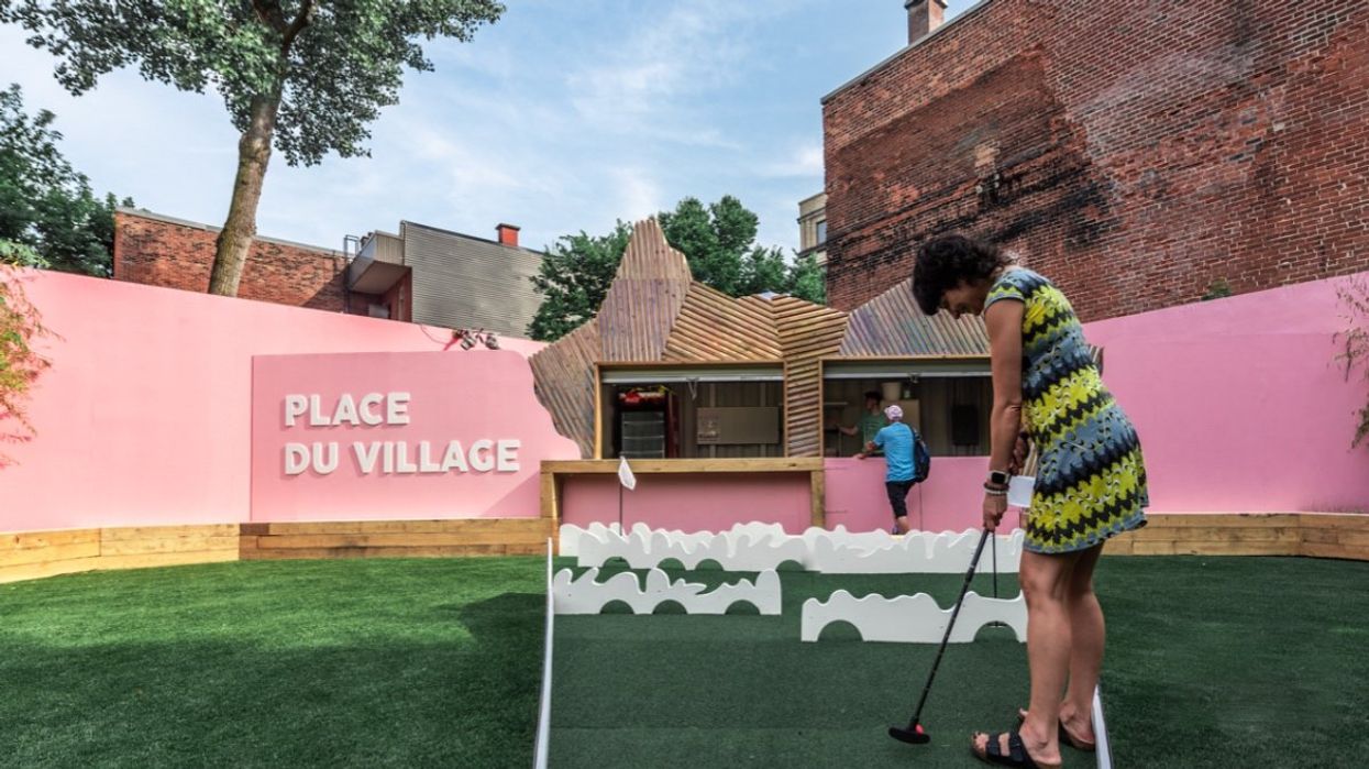 A person playing mini-golf at the Place du Village in Montreal, Quebec.