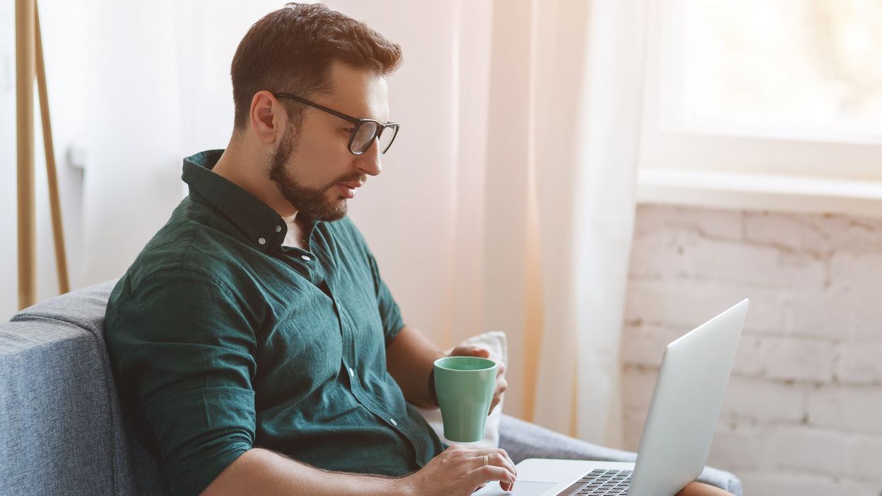 A person working remotely on their laptop.