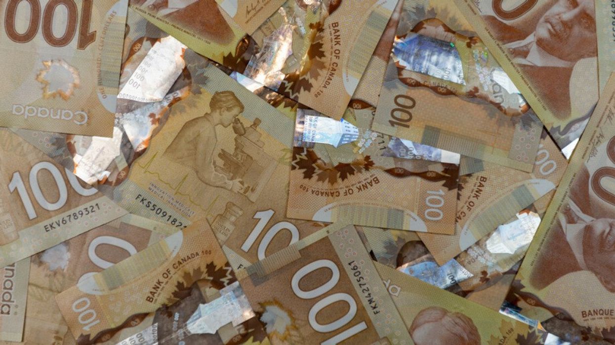 A pile of Canadian $100 bills.