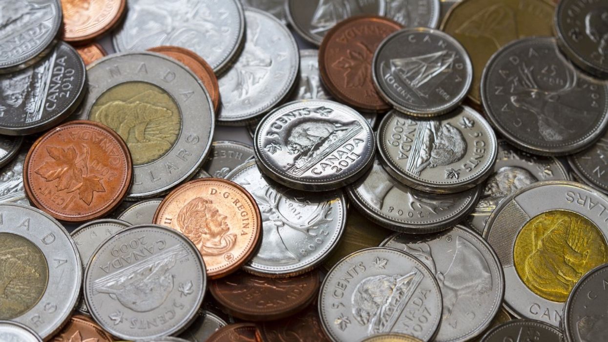 A pile of Canadian coins including a toonies ($2 coins), loonies ($1 coins), quarters, dimes, nickels and the discontinued penny.