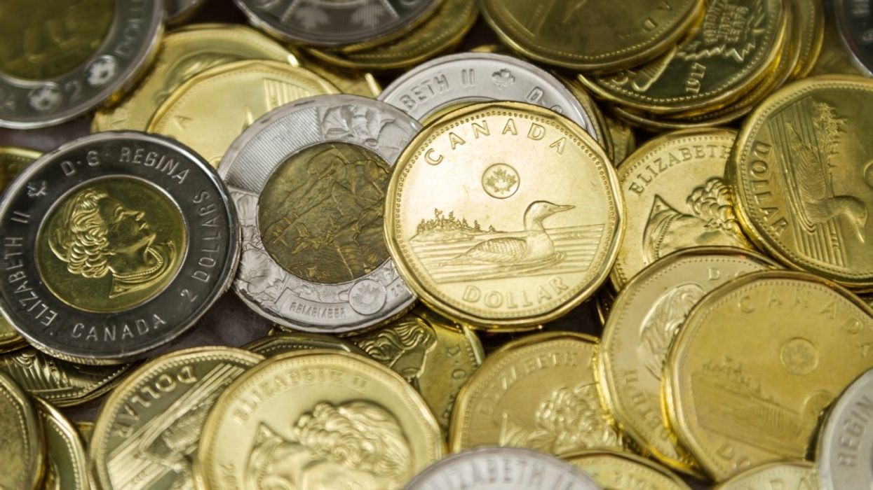 A pile of Canadian loonies and toonies.