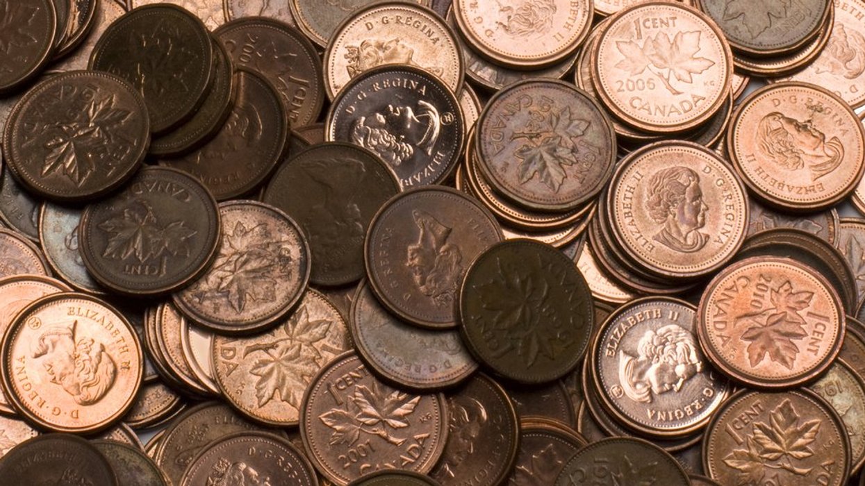 A pile of Canadian Pennies on a white background with copy space