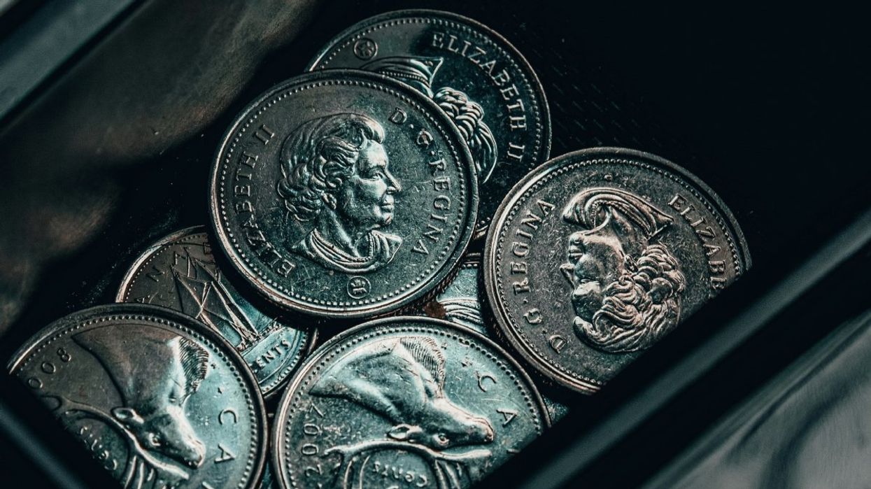 A pile of Canadian quarters and dimes.