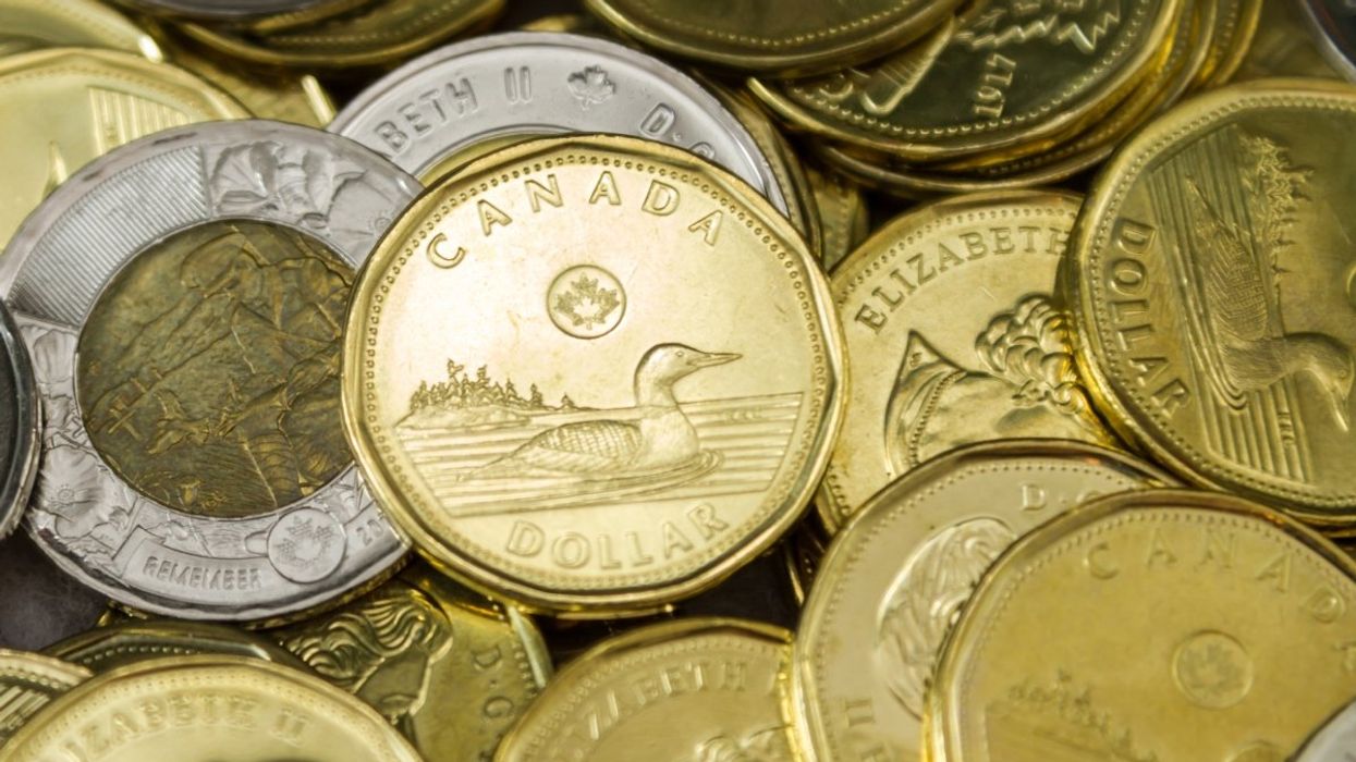 A pile of Canadian toonies ($2 coins), and loonies ($1 coins).