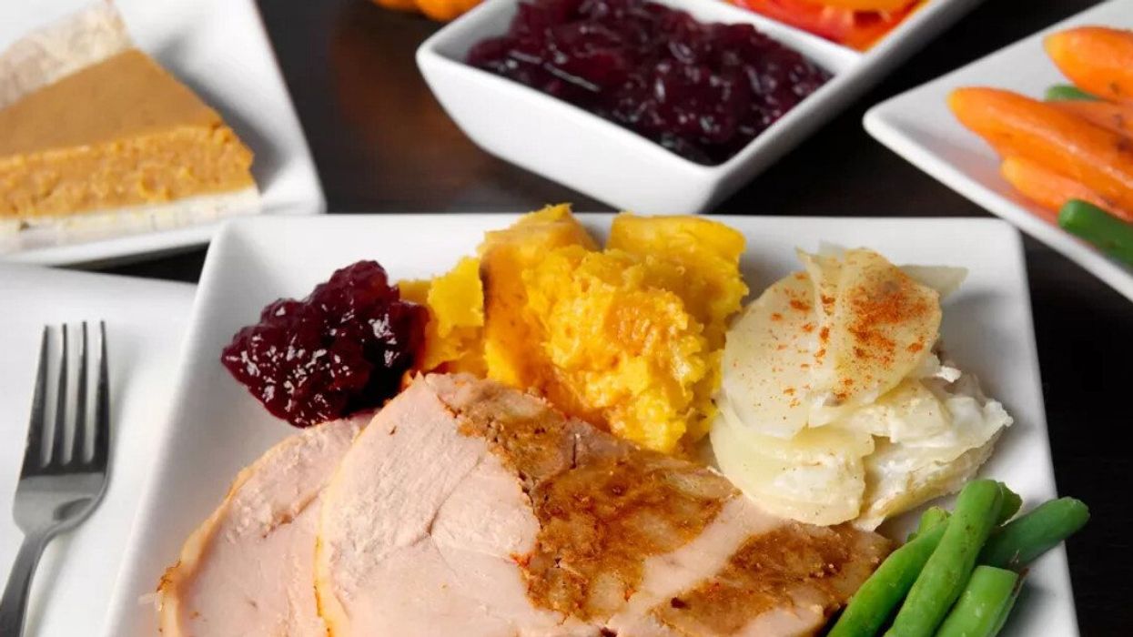 A plate with stuffing-filled turducken sold at Costco, and a spread of other Thanksgiving foods.
