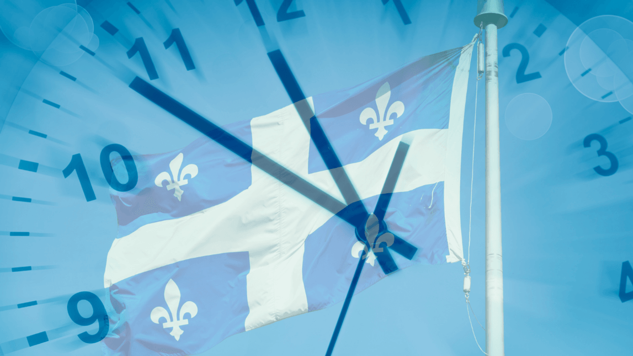 A Quebec flag with a clock.