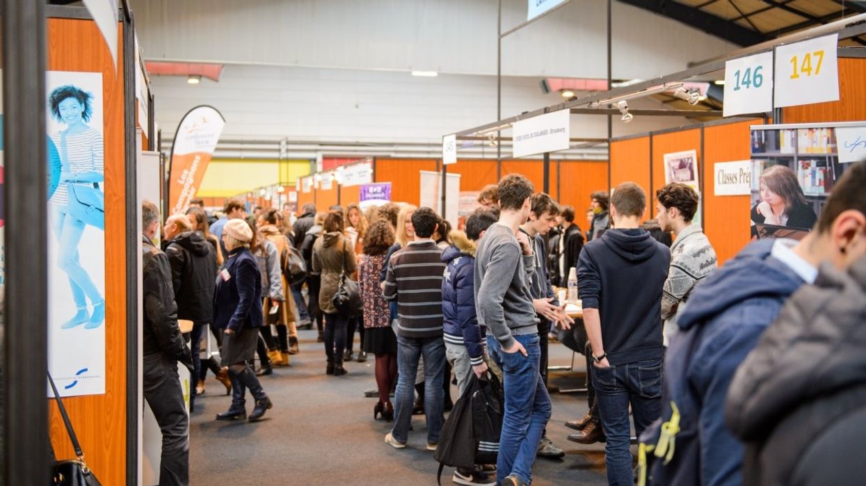 A room of people at a job fair.