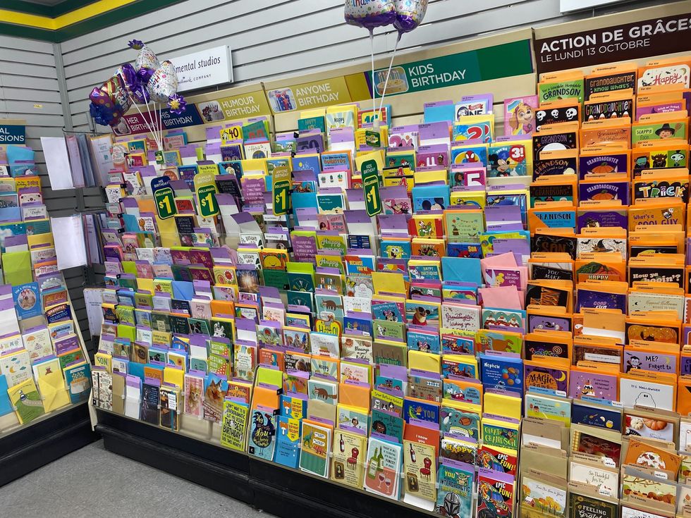 A row of birthday cards at a dollar store.