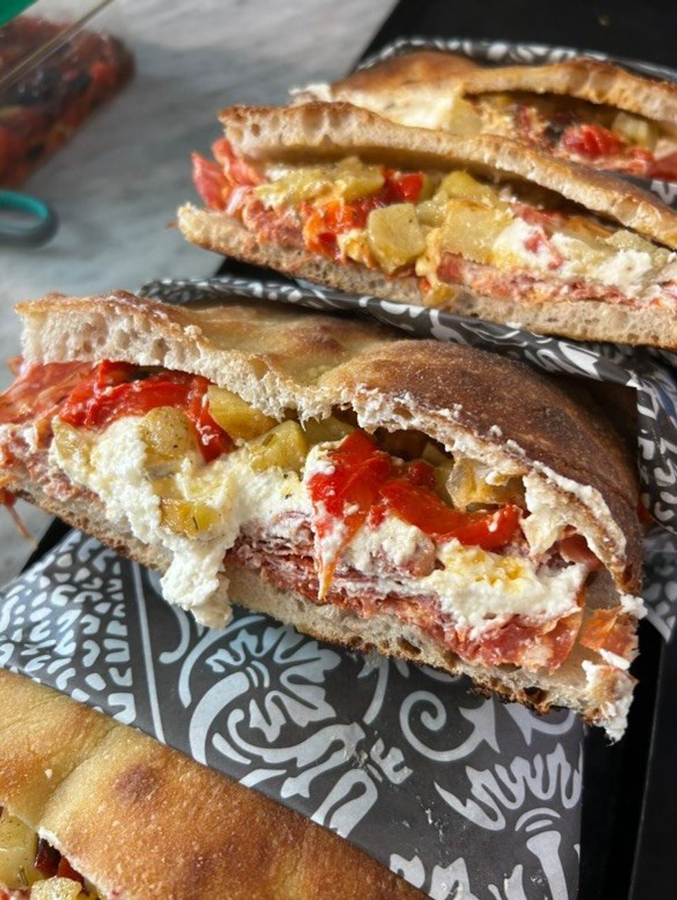 A row of sandwiches on a platter at Frankie's Pizza in Montreal.