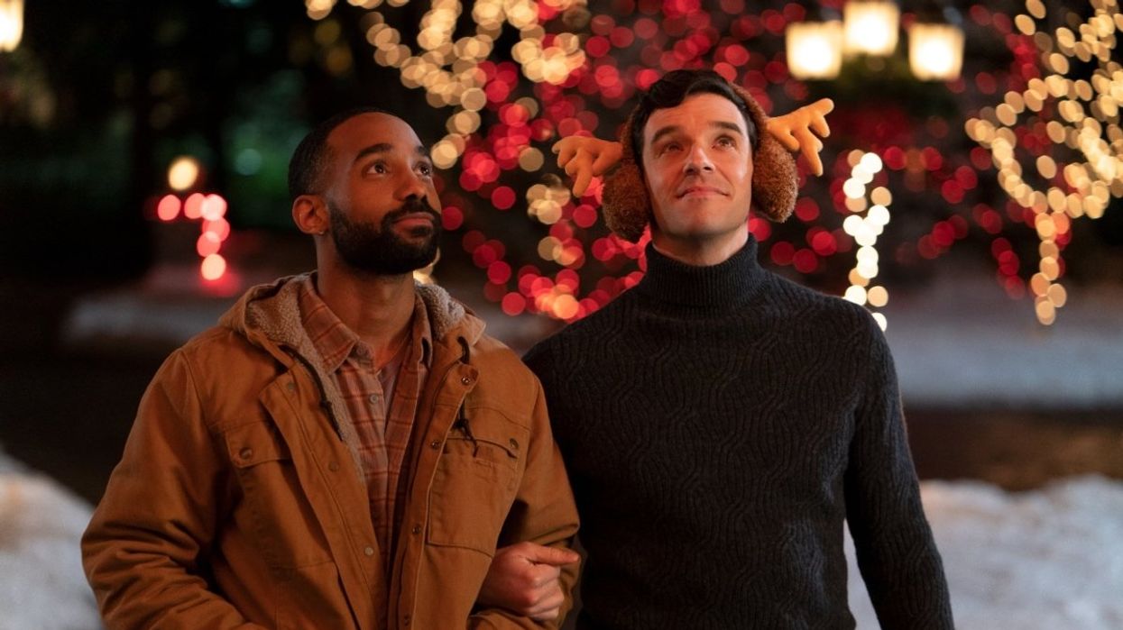 A scene from 'Single All The Way' featuring actor Michael Urie and Philemon Chambers.