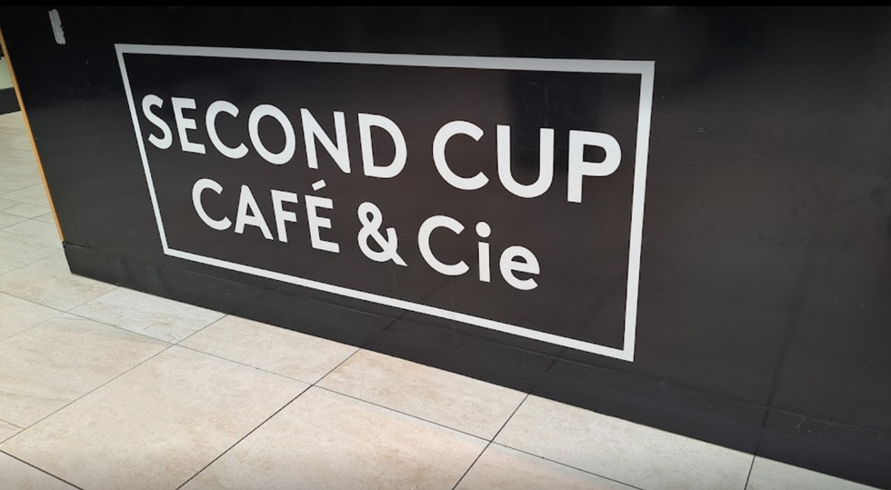 A Second Cup caf\u00e9 located inside a shopping mall.