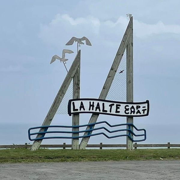 A sign for a roadside stop in Cap-Chat.