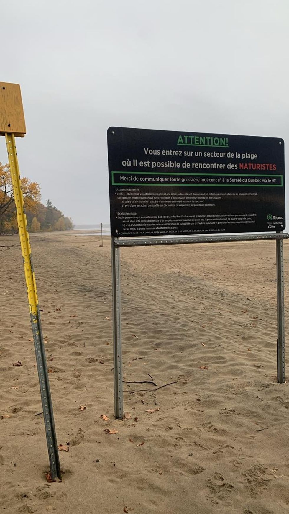 A sign identifying the nude section at Oka Beach in Quebec.