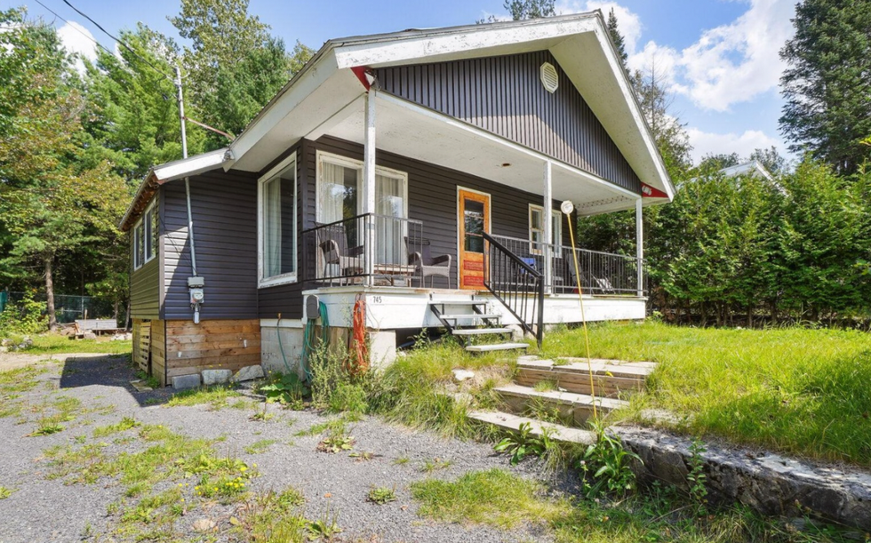 A small, cute home in the woods.