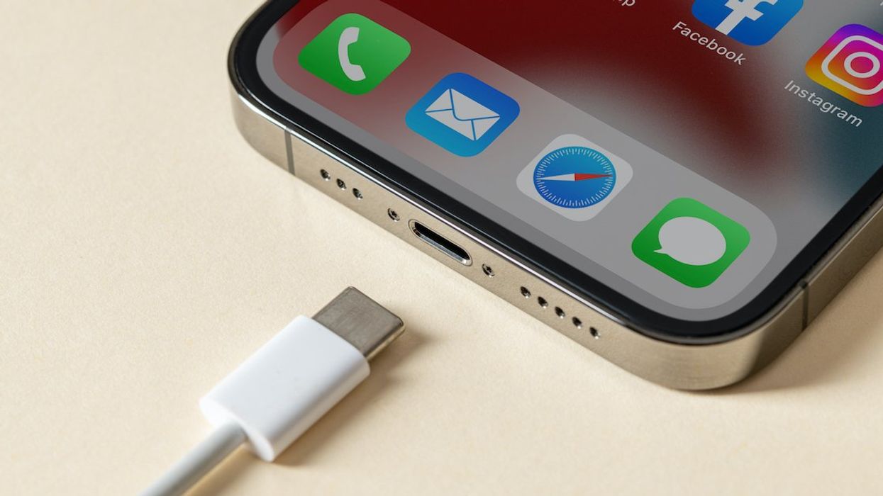 A smartphone and charging cable.