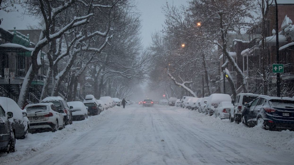 A snow-covered Montreal street at dusk.