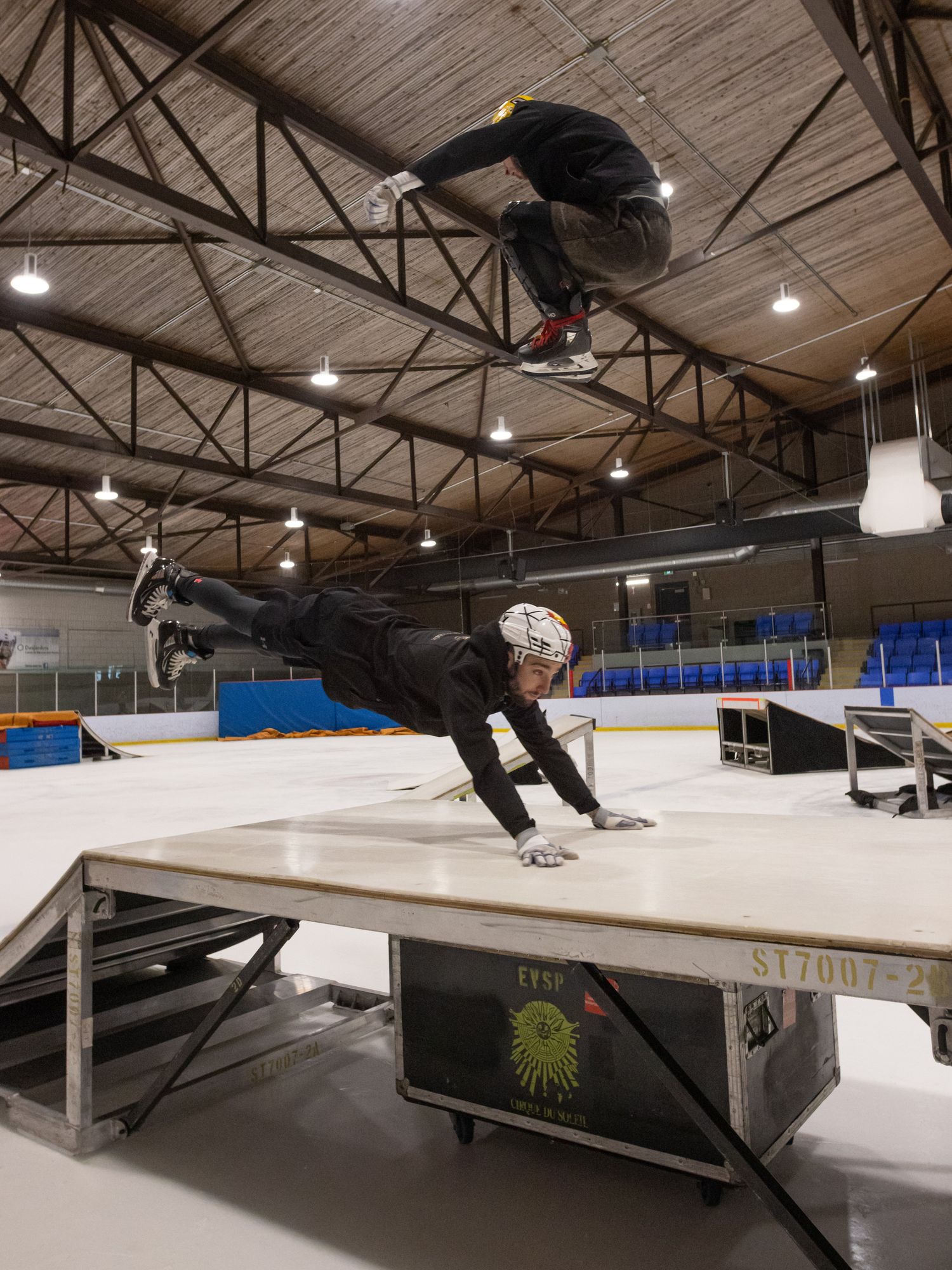A stunt involving one skater flying over another on a ramp.